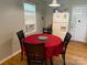 Cozy dining area featuring a round table with a red tablecloth, four chairs and natural light at 405 Jose St, Shelby, NC 28150