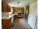 Functional kitchen featuring stainless steel appliances, wood cabinets and laminate flooring at 405 Jose St, Shelby, NC 28150