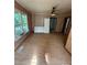 Bedroom with wood paneled walls, a ceiling fan, and new flooring at 4112 Hill Haven Dr, Vale, NC 28168