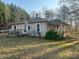 Cozy single-story home displaying a charming architectural design and a well-maintained lawn at 4112 Hill Haven Dr, Vale, NC 28168