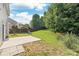 Spacious backyard with a patio, a playground, and a lush lawn at 4352 Haddington Dr, Fort Mill, SC 29707