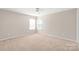 Bedroom features neutral paint, plush carpeting, and windows providing natural light at 4352 Haddington Dr, Fort Mill, SC 29707