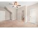 Bedroom featuring neutral walls, carpeting, a ceiling fan, and a walk-in closet at 4352 Haddington Dr, Fort Mill, SC 29707