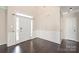 Spacious foyer with dark wood floors, white trim, and a large front door with sidelights at 4352 Haddington Dr, Fort Mill, SC 29707