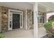 Close-up of the front door with stone accents, a porch column, and the house number at 4352 Haddington Dr, Fort Mill, SC 29707