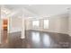 Bright living room with hardwood floors, crown molding, and large windows overlooking the yard at 4352 Haddington Dr, Fort Mill, SC 29707