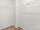 Walk-in closet with wall-mounted wire shelving and plush carpeting at 4352 Haddington Dr, Fort Mill, SC 29707
