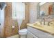 Unique powder room with patterned wallpaper, vanity, mirror, and window with natural light at 4630 Woodleaf Rd, Salisbury, NC 28147
