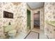 Classic bathroom with decorative wallpaper, green toilet, and an open view to stairs at 4630 Woodleaf Rd, Salisbury, NC 28147