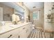 Bathroom featuring a vanity, toilet, framed mirror, and decorative wallpaper at 4630 Woodleaf Rd, Salisbury, NC 28147