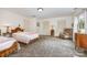 Cozy bedroom with two beds, hardwood furniture, ample closet space, and natural light at 4630 Woodleaf Rd, Salisbury, NC 28147
