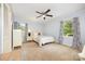 Bright bedroom with light blue walls, windows, and a ceiling fan at 4630 Woodleaf Rd, Salisbury, NC 28147