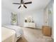 Spacious bedroom featuring neutral carpet, light blue walls, and a ceiling fan at 4630 Woodleaf Rd, Salisbury, NC 28147