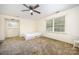 Bright bedroom featuring neutral walls, carpet, ceiling fan, and natural light from multiple windows at 4630 Woodleaf Rd, Salisbury, NC 28147