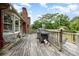 Outdoor deck area featuring a gas grill, lounge chairs, and view of lush greenery at 4630 Woodleaf Rd, Salisbury, NC 28147