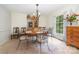 Bright dining room with a vintage china cabinet and decorative window treatments at 4630 Woodleaf Rd, Salisbury, NC 28147