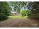 Charming two-story home with a brick facade and lush landscaping in a serene setting at 4630 Woodleaf Rd, Salisbury, NC 28147