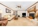 Large living room with a brick fireplace, neutral carpet and lots of natural light at 4630 Woodleaf Rd, Salisbury, NC 28147