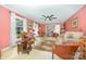 Cozy living room featuring neutral carpet, ceiling fan, and abundant light at 4630 Woodleaf Rd, Salisbury, NC 28147