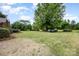 Lush backyard with mature trees and greenery, featuring a vintage truck and a peaceful ambiance at 4630 Woodleaf Rd, Salisbury, NC 28147