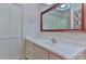 Bathroom featuring a wide mirror, extended vanity, and louvered closet doors at 466 Shiloh Church Rd, Hickory, NC 28601