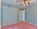Standard bedroom featuring a ceiling fan, closet, and pink carpet at 466 Shiloh Church Rd, Hickory, NC 28601