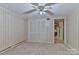 Neutral bedroom with wood-panelled walls and a large closet at 466 Shiloh Church Rd, Hickory, NC 28601