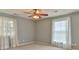 Cozy bedroom featuring neutral carpet, a ceiling fan, and two windows at 466 Shiloh Church Rd, Hickory, NC 28601