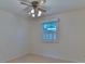 Cozy bedroom featuring neutral carpet, a ceiling fan, and a window at 466 Shiloh Church Rd, Hickory, NC 28601