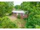 Well-kept brick home featuring mature trees and a meticulously manicured lawn at 466 Shiloh Church Rd, Hickory, NC 28601