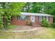 Charming brick home with classic shutters and a welcoming front entrance and a metal roof at 466 Shiloh Church Rd, Hickory, NC 28601
