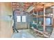 Garage with an open ceiling, double doors for access, and shelving for storage, combining utility with potential for future projects at 466 Shiloh Church Rd, Hickory, NC 28601