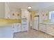 Well-lit kitchen features ample cabinet space, stone tile flooring, and modern appliances at 466 Shiloh Church Rd, Hickory, NC 28601