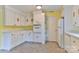 Kitchen with white cabinets, stone tile flooring, and modern appliances at 466 Shiloh Church Rd, Hickory, NC 28601