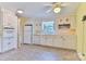 Bright kitchen with white cabinets, stone tile flooring, and modern appliances at 466 Shiloh Church Rd, Hickory, NC 28601