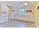Bright kitchen with white cabinets, stone tile flooring, and modern appliances at 466 Shiloh Church Rd, Hickory, NC 28601