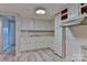 Compact kitchen features ample white cabinets, laminate counters, and hardwood style floors at 466 Shiloh Church Rd, Hickory, NC 28601