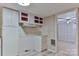 Vintage kitchen with unique red-accented cabinets, a retro range hood, and an adjacent doorway, offering a glimpse into the home's layout at 466 Shiloh Church Rd, Hickory, NC 28601