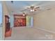 Living room features a fireplace, built-in shelving, carpet, and ceiling fans at 466 Shiloh Church Rd, Hickory, NC 28601