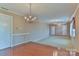 Spacious living room featuring hardwood floors and a chandelier at 466 Shiloh Church Rd, Hickory, NC 28601