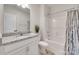 Clean, bright bathroom featuring granite countertops, a shower, and ample storage at 4689 Kingswood Dr, Indian Land, SC 29707