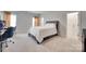 Bright bedroom with soft carpet, neutral walls, and modern accents, perfect for relaxation at 4689 Kingswood Dr, Indian Land, SC 29707