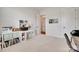 Comfortable, carpeted bedroom with neutral walls, desk, and ample storage at 4689 Kingswood Dr, Indian Land, SC 29707