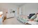 Cozy bedroom featuring a bed with patterned bedding and a dresser with mirror at 4689 Kingswood Dr, Indian Land, SC 29707