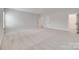 Large bonus room with neutral carpet and plenty of room for activities at 4689 Kingswood Dr, Indian Land, SC 29707