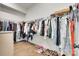 Large walk-in closet with ample hanging space, hardwood floors, and shoe storage at 4689 Kingswood Dr, Indian Land, SC 29707
