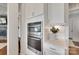 Bright kitchen features stainless steel oven and microwave, white cabinets, and stone countertops at 4689 Kingswood Dr, Indian Land, SC 29707