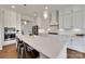 Modern kitchen with stainless steel appliances, a large island, and white cabinetry at 4689 Kingswood Dr, Indian Land, SC 29707