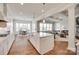 Spacious kitchen with center island and adjacent living and dining areas at 4689 Kingswood Dr, Indian Land, SC 29707