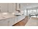 Bright kitchen with white cabinets, subway tile backsplash, and stainless appliances at 4689 Kingswood Dr, Indian Land, SC 29707
